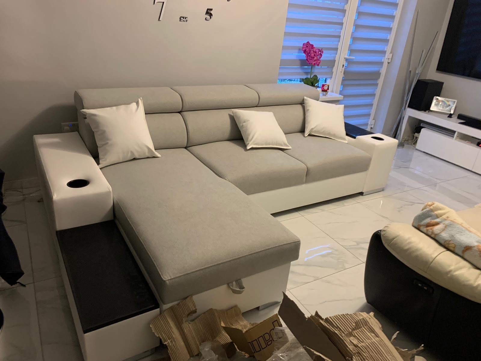 Light grey corner sofa with storage on a marble floor, customer photo